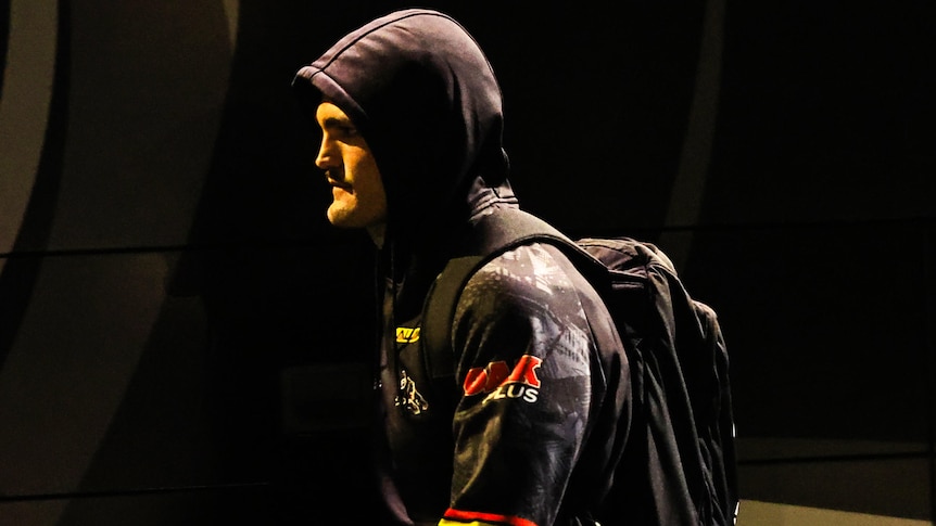 Nathan Cleary looking upset as he walks to the Panthers team bus.