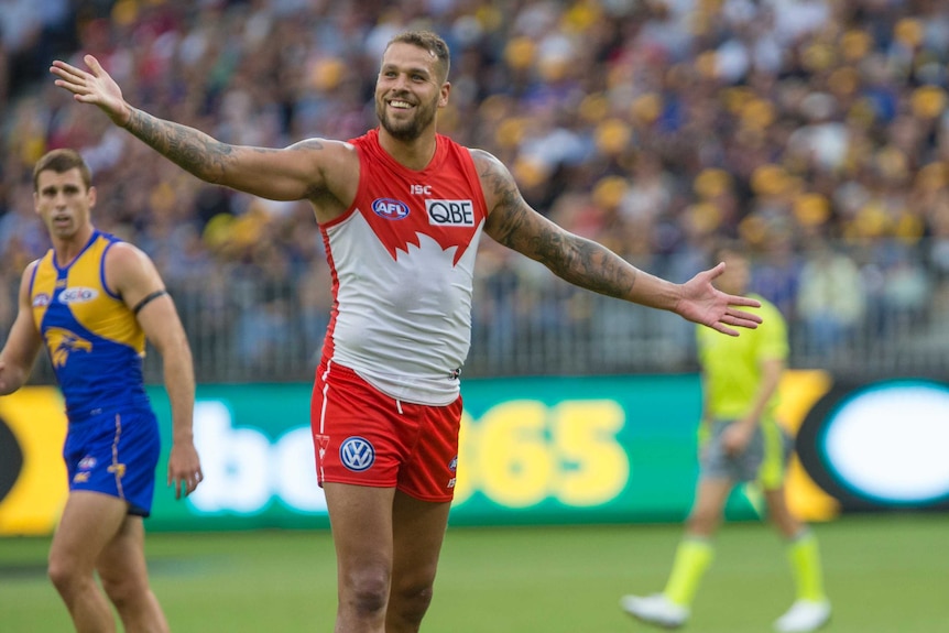 Lance Franklin gestures to the crowd after kicking a goal for Sydney