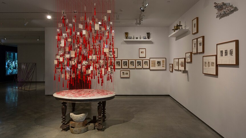 Colour photo of artworks Colony (left) and The Vietnam Archive Project on display in the Museum of Contemporary Art in Sydney.