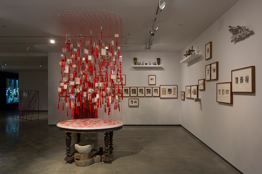 Colour photo of artworks Colony (left) and The Vietnam Archive Project on display in the Museum of Contemporary Art in Sydney.