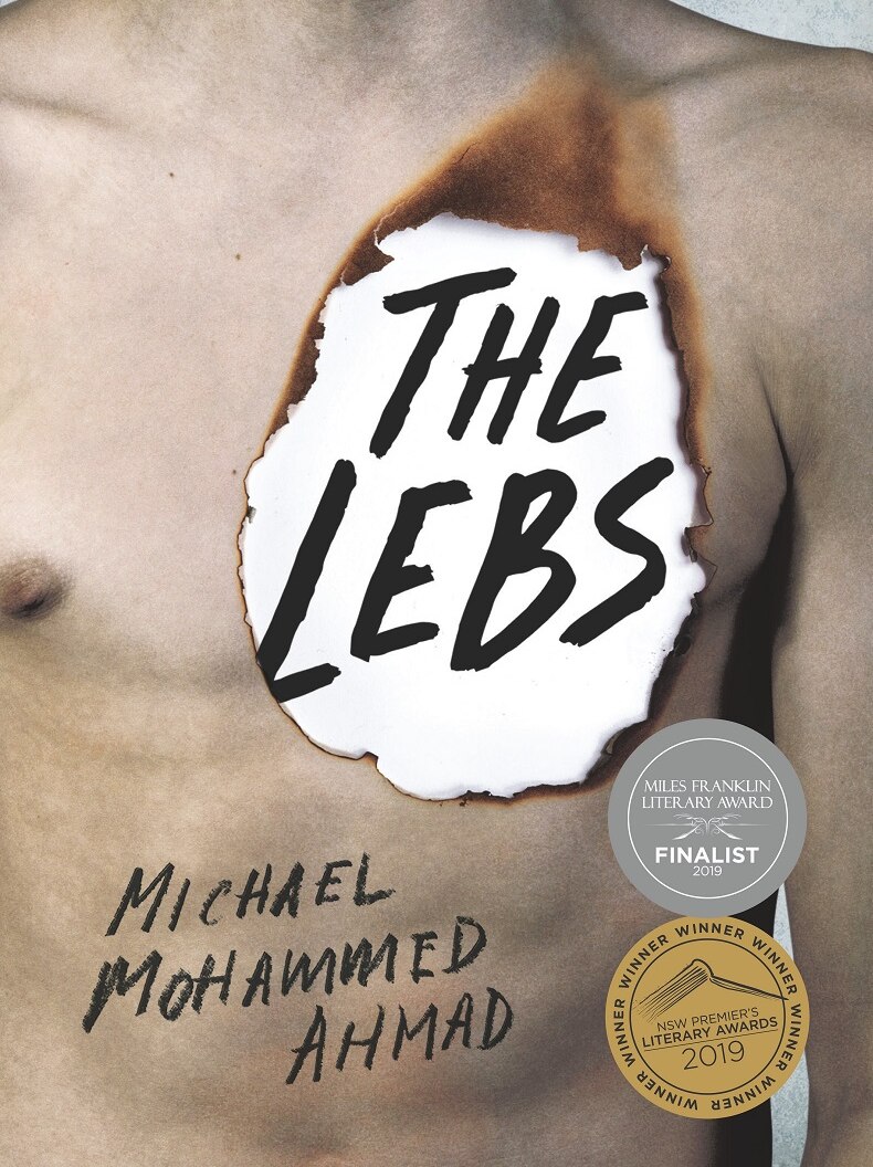 The book cover shows a man's naked torso with the title burned through his chest like paper.