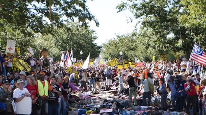 Demonstrators staged a die-in, drawing attention to the rising death toll in Iraq