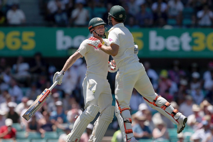 Shaun and Mitch Marsh are distracted by hugs