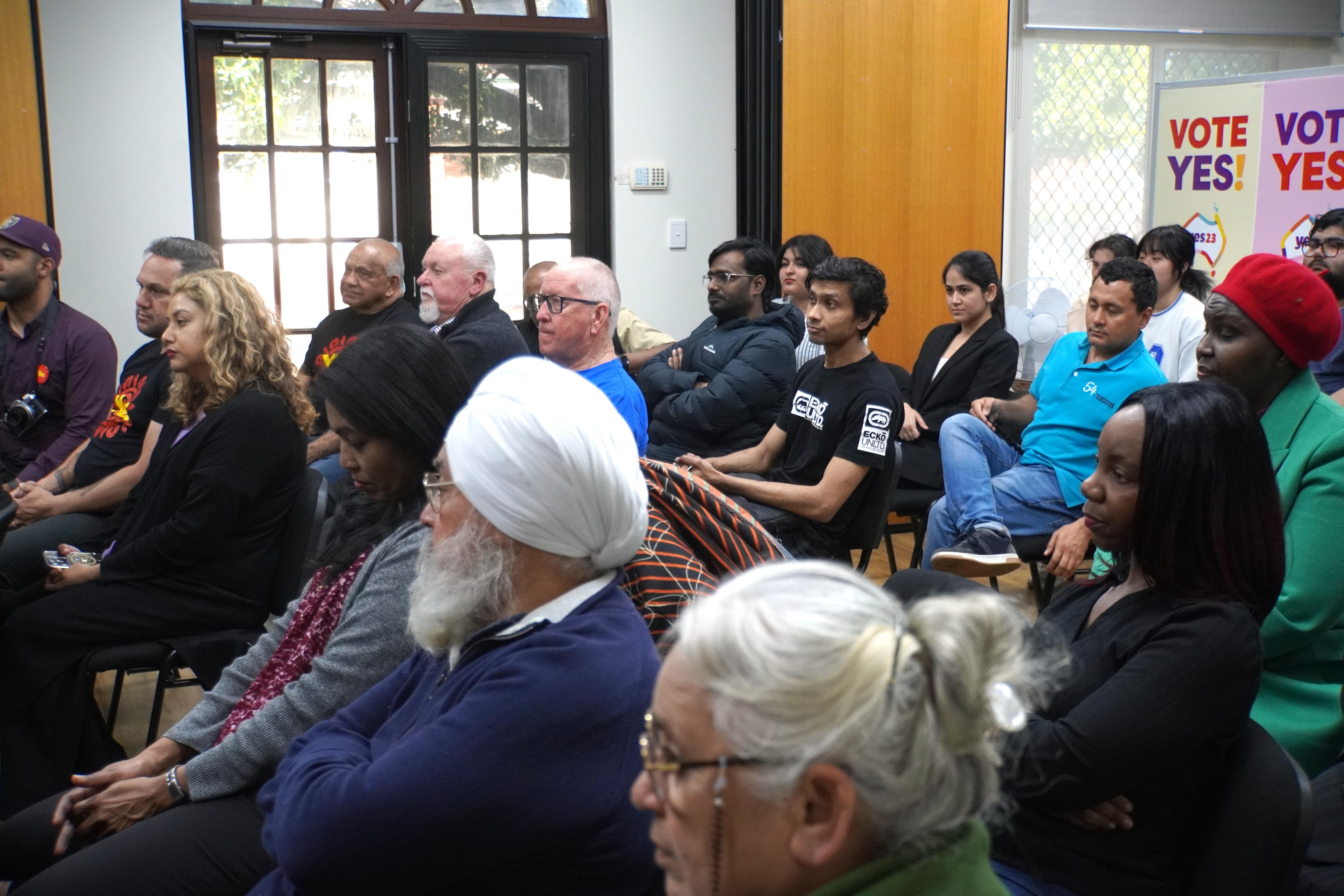 Community leaders seated for a gathering on the Yes campaign.