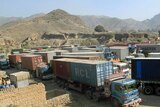Trucks carrying NATO supplies park at Pakistan's Torkham border crossing