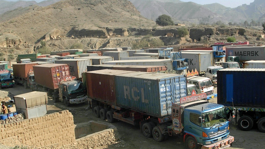 Trucks carrying NATO supplies park at Pakistan's Torkham border crossing.