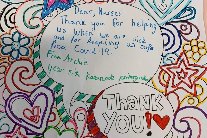 A colourful card decorated by a primary aged student thanking nurses for helping people during COVID-19.