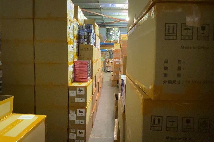 A close-up shot of cardboard boxes in a warehouse.