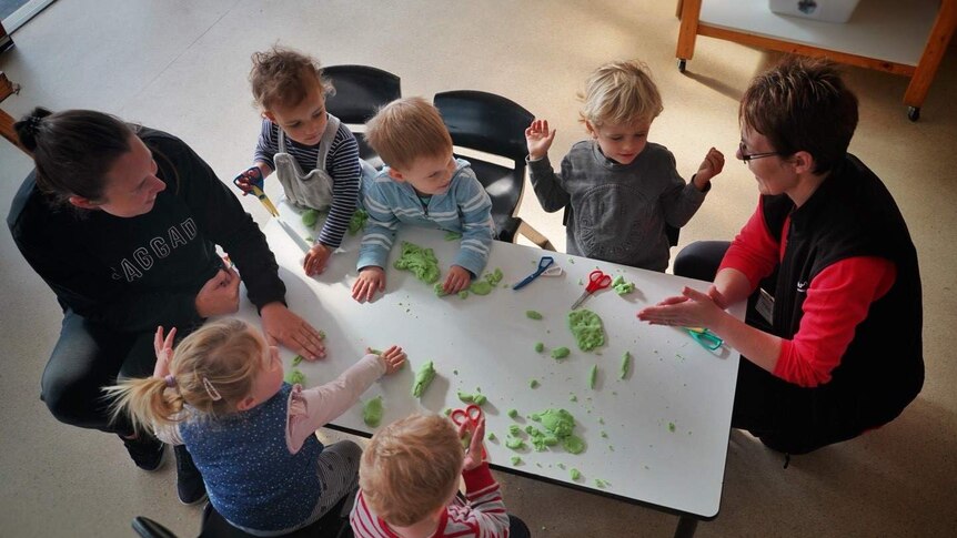 Children at a child care table.