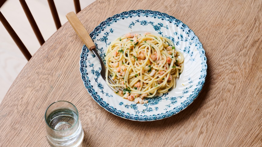 A patterned plate of spaghetti with prawns, lemon, chilli and garlic by Julia Busuttil Nishimura. An easy spring meal.