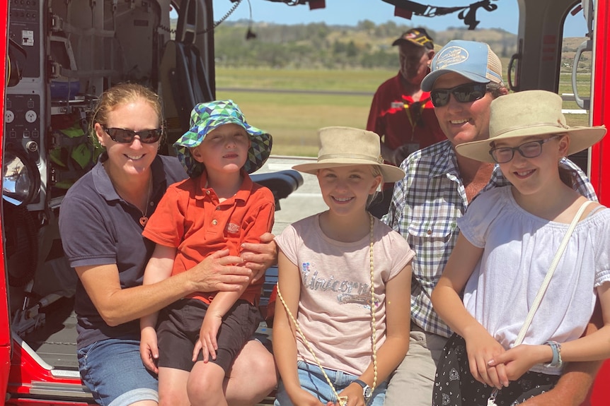 Pip Johnston holding her son Tom, with father Paul and sisters Annabelle and Jessica.