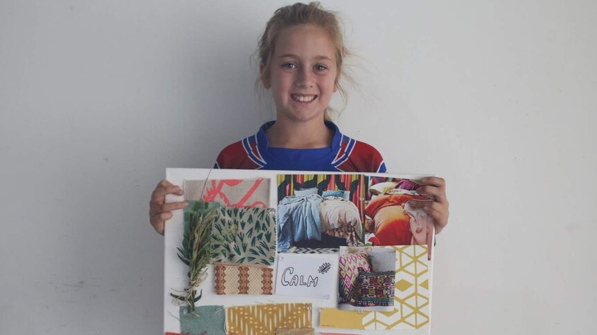 Millie Thompson smiling with her mood board