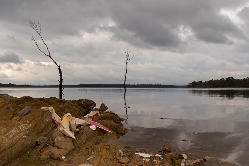 A landscape image of Lake Eppalock with litter in the foreground.