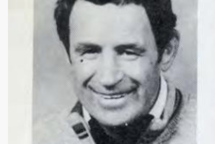 A black and white headshot of John Coogan