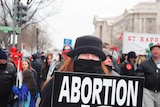 A woman walks in the 32nd Annual March For Life in Washington, 2005.