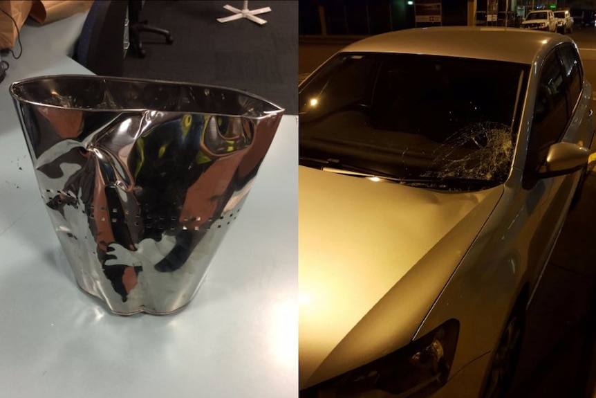 Metal bin and smashed car