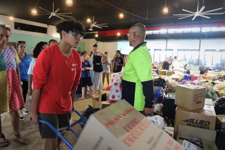 A man wheels a box at a Timor-Leste donation drive in Darwin, April 2021.