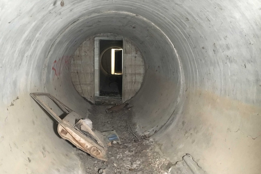 Old car door inside a tunnel