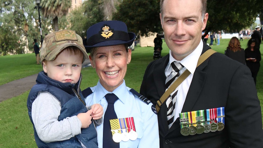 Sheena and Dan Stapleton with their child on Anzac Day.