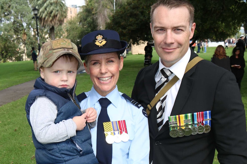 Sheena and Dan Stapleton with their child on Anzac Day.