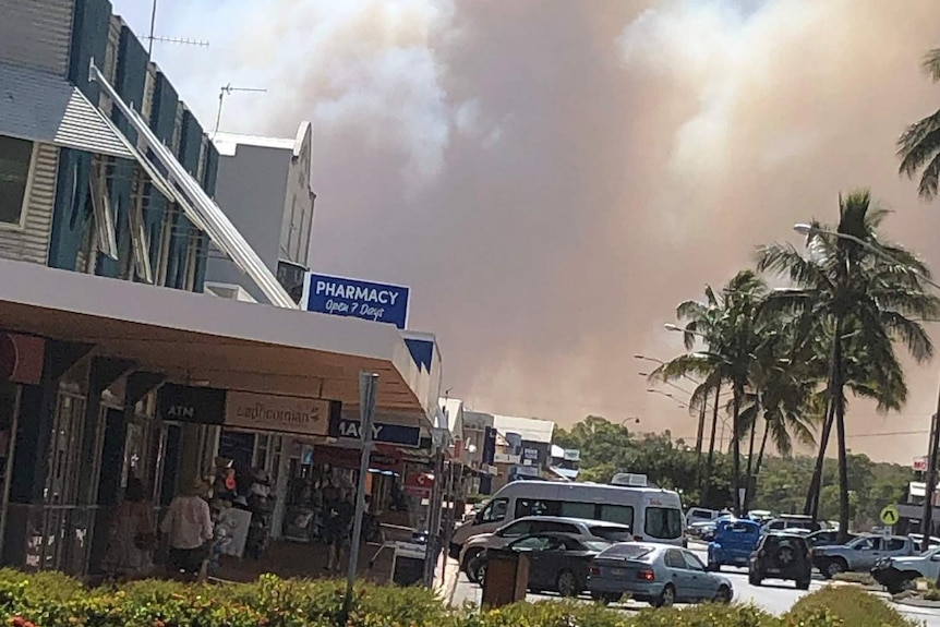 Smoke from bushfire looms large as seen from Main Street of Yeppoon.