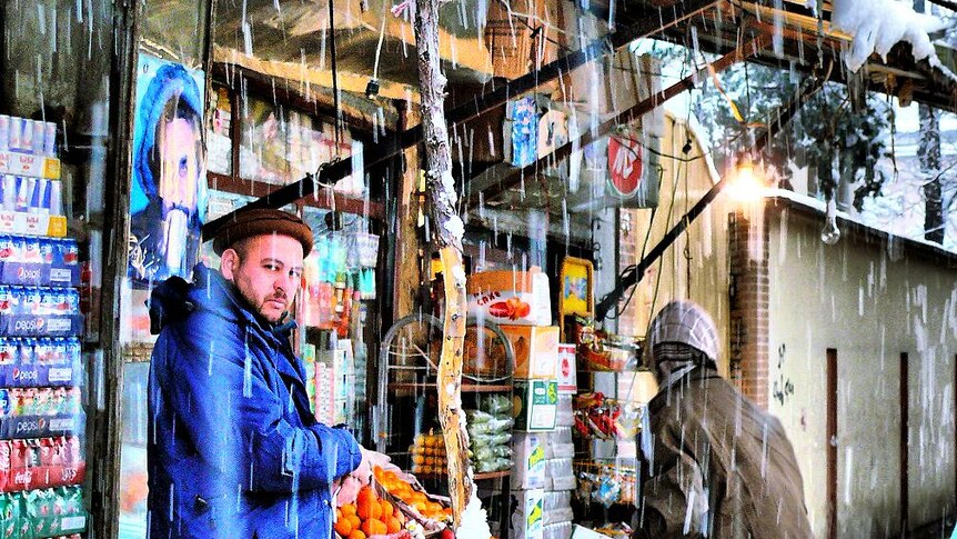 A shop in Kabul trades in the snow.