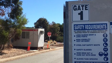 A gate displaying safety requirements at the Water Corporation's Woodman Point Wastewater Treatment Plant.