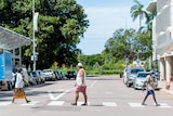 three people crossing the road in darwin