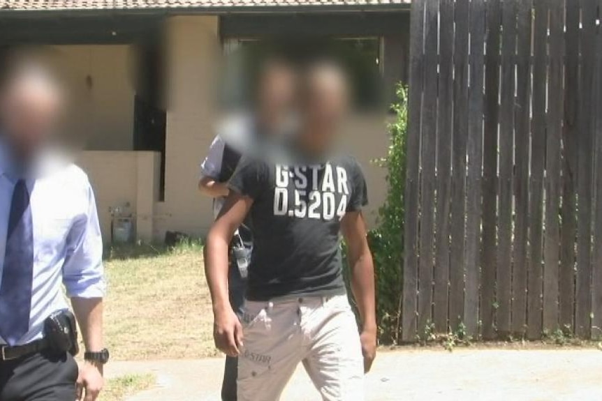 Police raid a house in Charnwood and arrest three men over a Macgregor drug house in Canberra. Taken January 9, 2013.