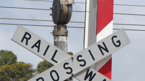 A man and a woman were killed when their ute drove through a train crossing.