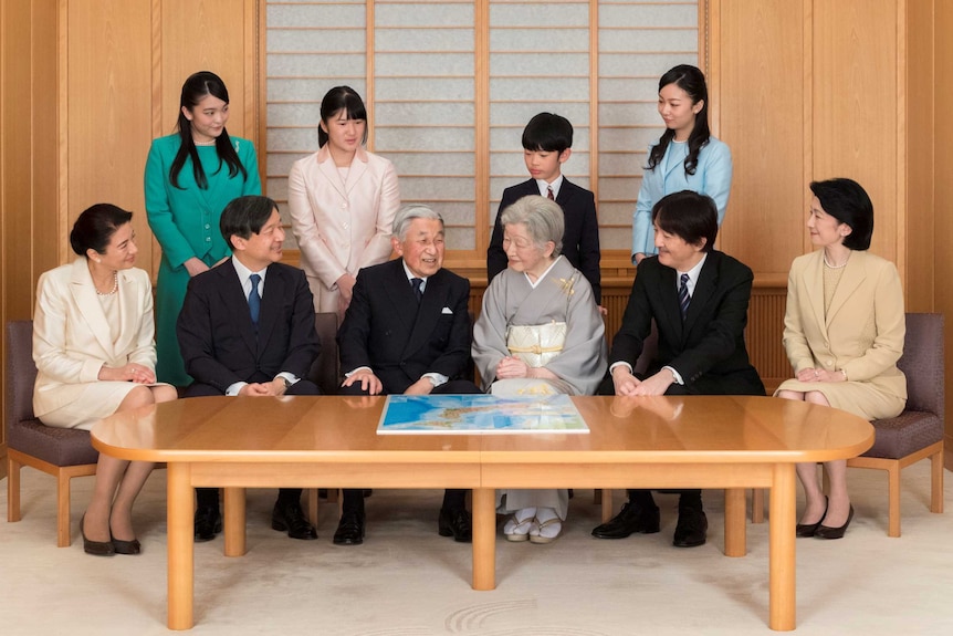Members of the Japanese imperial family sitting around a table