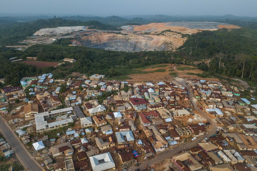 An aerial shot shows the town of Ayanfuri in proximity to the Perseus gold mine.