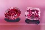 A close up of a pink and red diamond