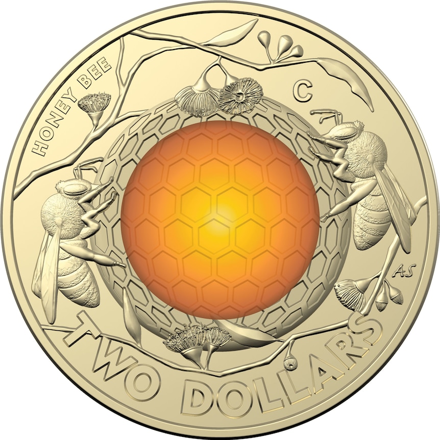  A $2 coin featuring a honey bee wrapped around honeycomb