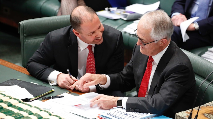 Malcolm Turnbull shares a smile with Josh Frydenberg during question time