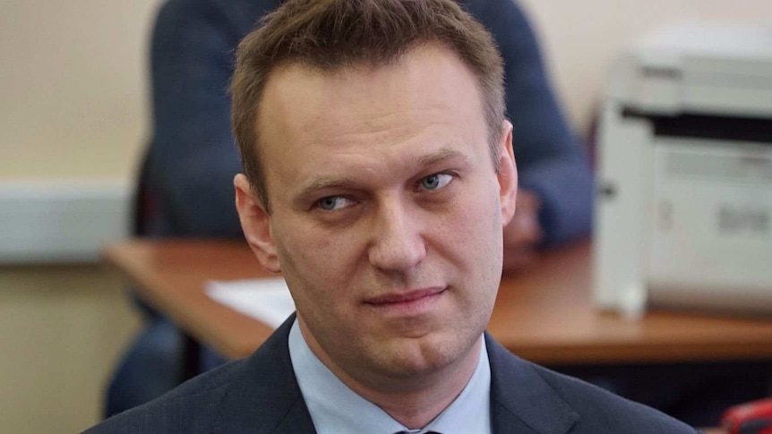 Russian political activist Alexei Navalny stares off camera.