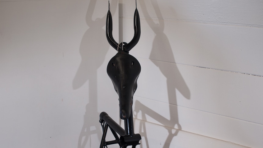 A stumpy gazelle made from bicycle pieces.