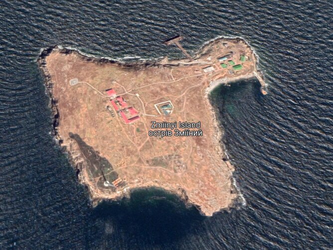 An annotated aerial image of a small island with a few buildings on it.