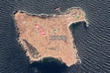 An annotated aerial image of a small island with a few buildings on it.