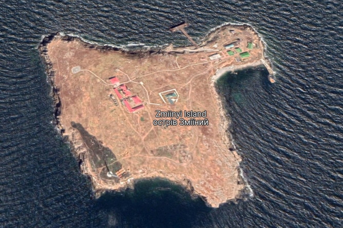 An annotated aerial image of a small island with a few buildings on it.