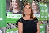 Greens' Northcote candidate Lidia Thorpe hands out how-to-vote cards on election day.