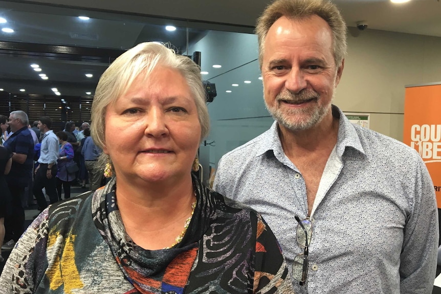 Sam McMahon and Nigel Scullion both smile at the camera.