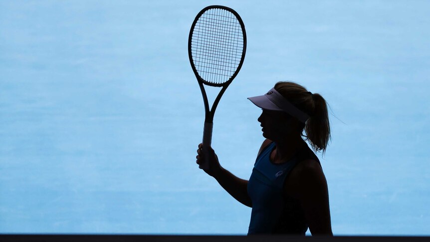 Coco Vandeweghe in silhouette during her Australian Open quarter-final against Garbine Muguruza.