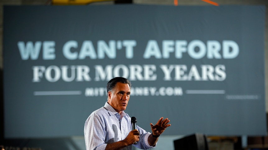 Mitt Romney pauses while speaking at a campaign stop at American Spring Wire in Bedford Heights, Ohio.