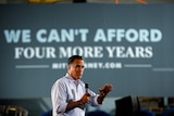 Mitt Romney pauses while speaking at a campaign stop at American Spring Wire in Bedford Heights, Ohio.