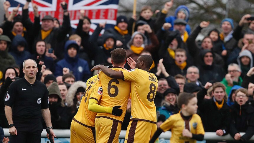 Sutton United players celebrate Jamie Collins' goal against Leeds in the FA Cup on January 29, 2017.