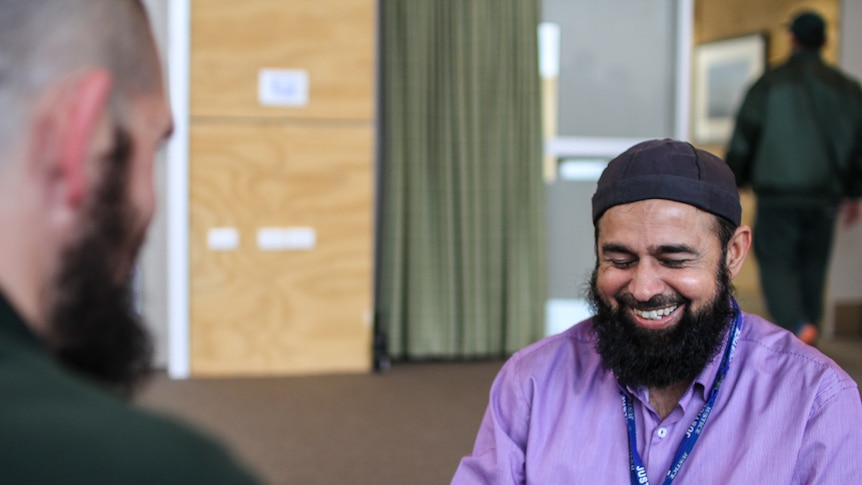 Prisoner 'Simon' and chaplain Altaf Hussain smiling at the multi-faith centre at Hopkins Correctional Centre.