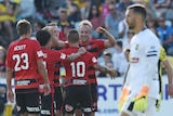 Wanderers celebrate a goal against the Mariners