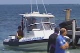 Marine parks boat pulls up to the jetty