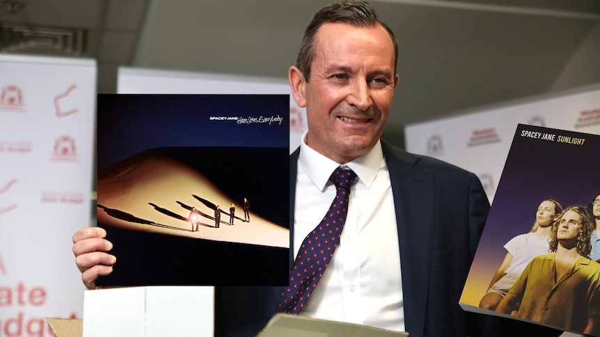A photoshop of WA Premier Mark McGowan holding Spacey Jane vinyl LPs